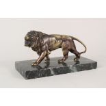 A bronzed figure of a standing lion on marble base,