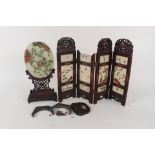 A Chinese jade and hardstone oval plaque on carved wooden stand plus a four fold table screen (as