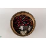 A wicker basket containing good quality bead necklaces including hard stones,