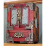 A Chinese table cabinet with brass mounts and hardstone panels