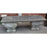 A weathered twin base garden stone seat,