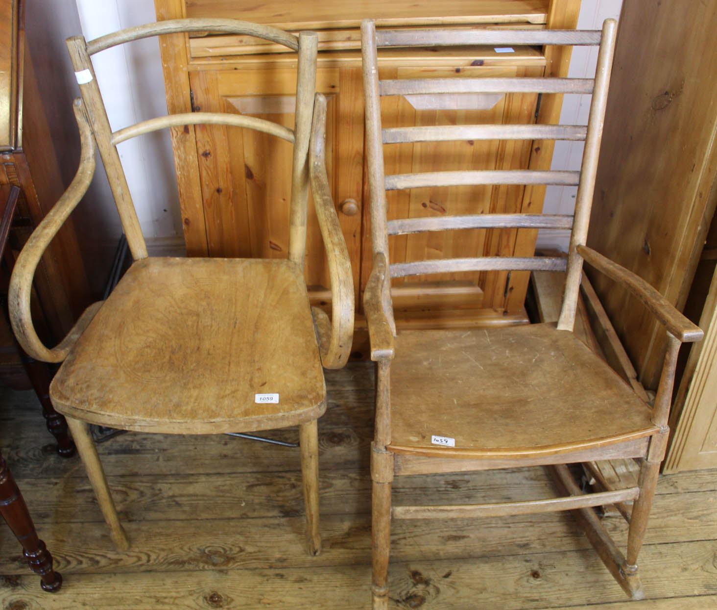 A bentwood armchair and a beech ladderback rocking chair