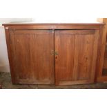 A large late Victorian oak two door school cupboard