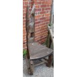 A weathered rustic drift wood garden seat