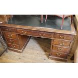 A 1920's mahogany pedestal desk with black leatherette top