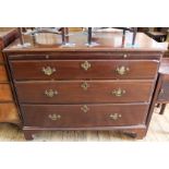 A Georgian mahogany three drawer chest with slide,