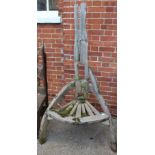 A large weathered rustic garden seat made from drift wood