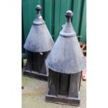 A pair of early 20th Century black painted ventilation chimney tops