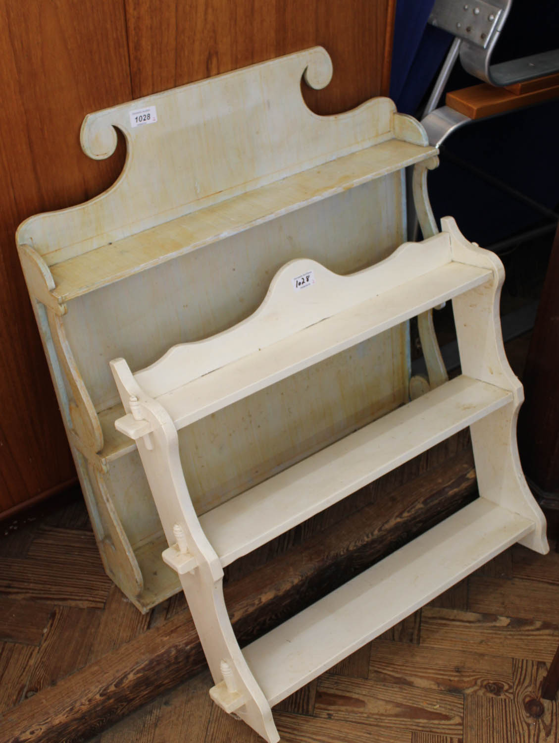 Two painted hanging shelves