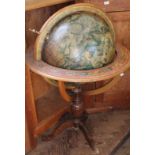 A modern decorated rotating globe on a stand (as found)