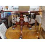 A Victorian style mahogany round tripod table