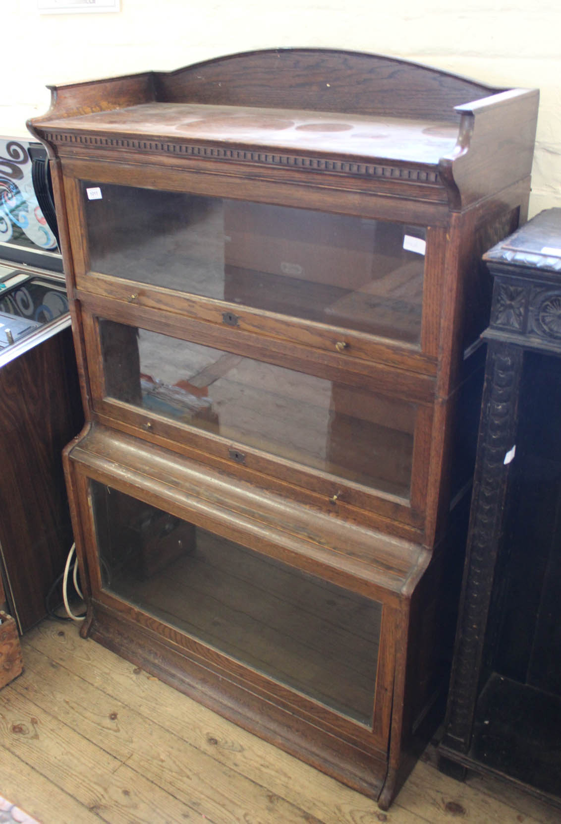 A three tier Lebus sectional glazed bookcase