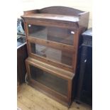 A three tier Lebus sectional glazed bookcase