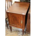 An Edwardian inlaid mahogany pot cupboard with single door on castors