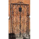 A large iron gate with hinge