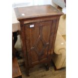 An Edwardian pine single door cupboard on legs