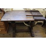 An oak 1920's extending oak dining table with one leaf extension