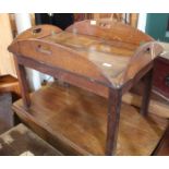 A Georgian mahogany butler's tray which has been converted into a coffee table