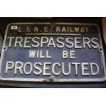 A cast iron L & N E Railway Trespassers Will Be Prosecuted sign,