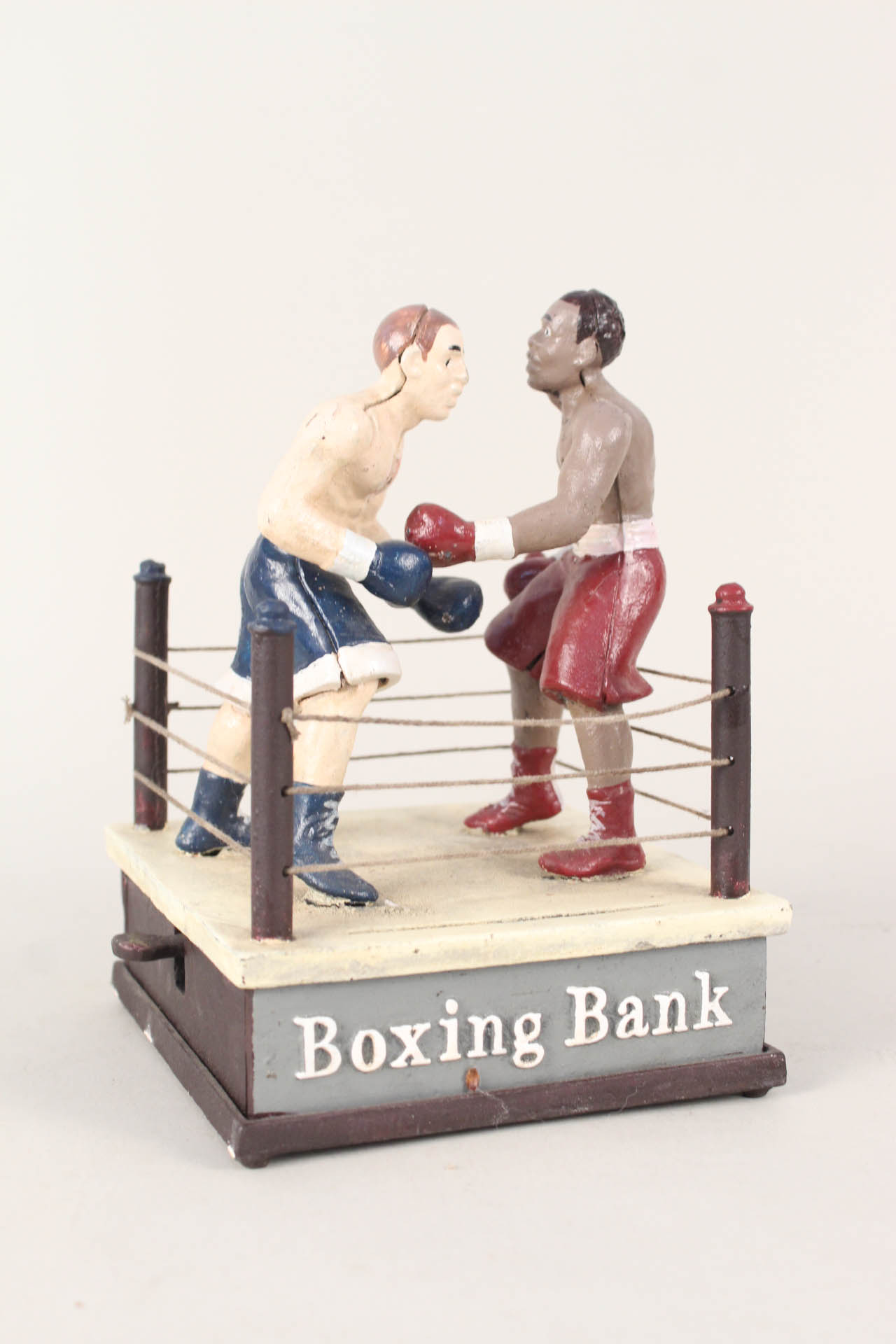 An iron mechanical boxing bank