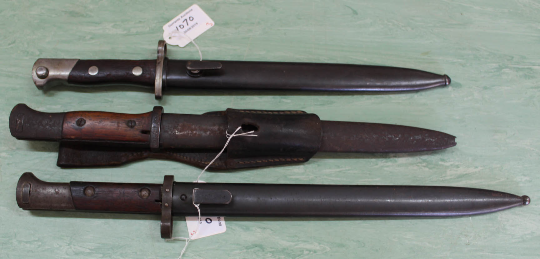 Three various Mauser bayonets,