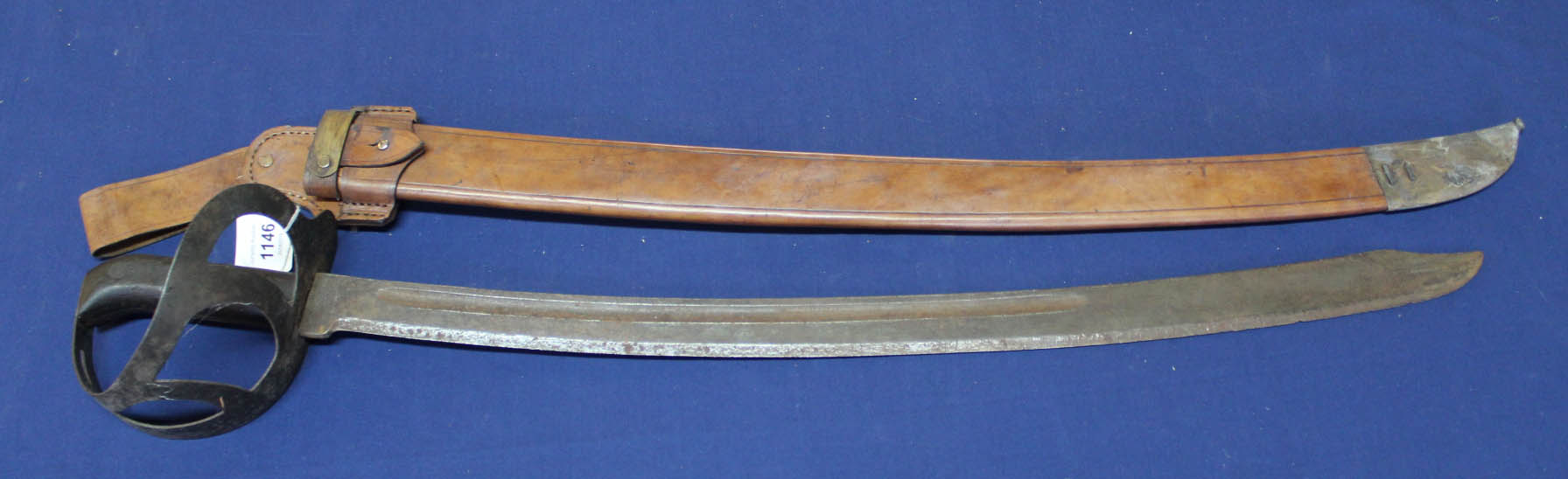 A Dutch Klewang 'cutlass' complete with leather scabbard and frog