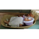 Two composition dressed dolls in basket