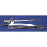 A British model 1856 sword bayonet (scabbard as found) with a brass hilted sabre bayonet marked A &