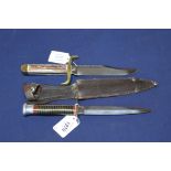 A small Bowie knife marked Sheffield England with a F&S style fighting knife,