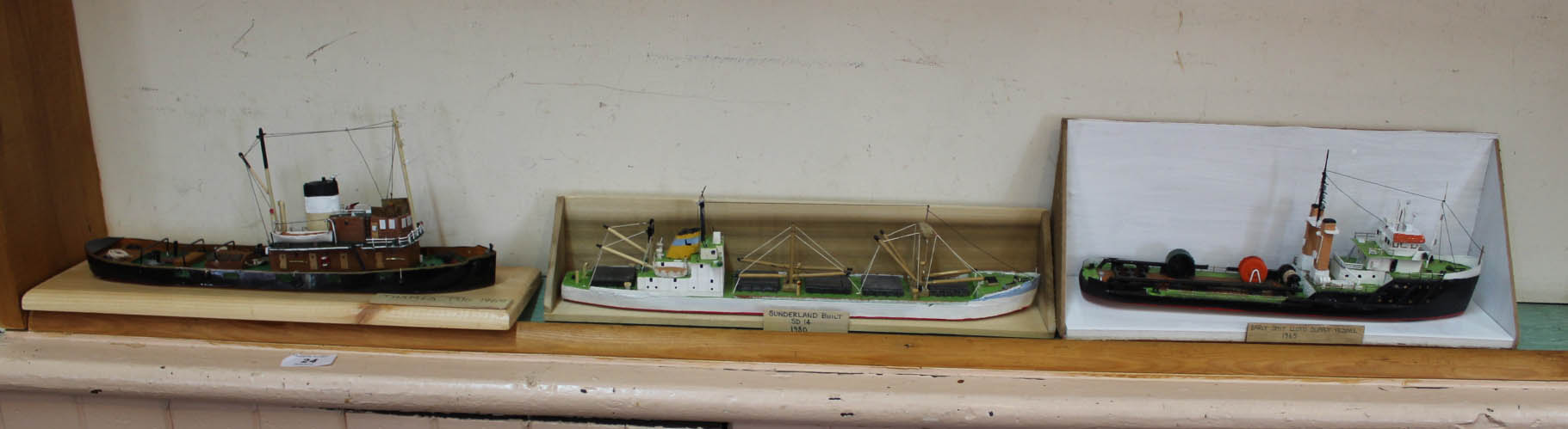 Four wooden model boats including 1969 Thames tug