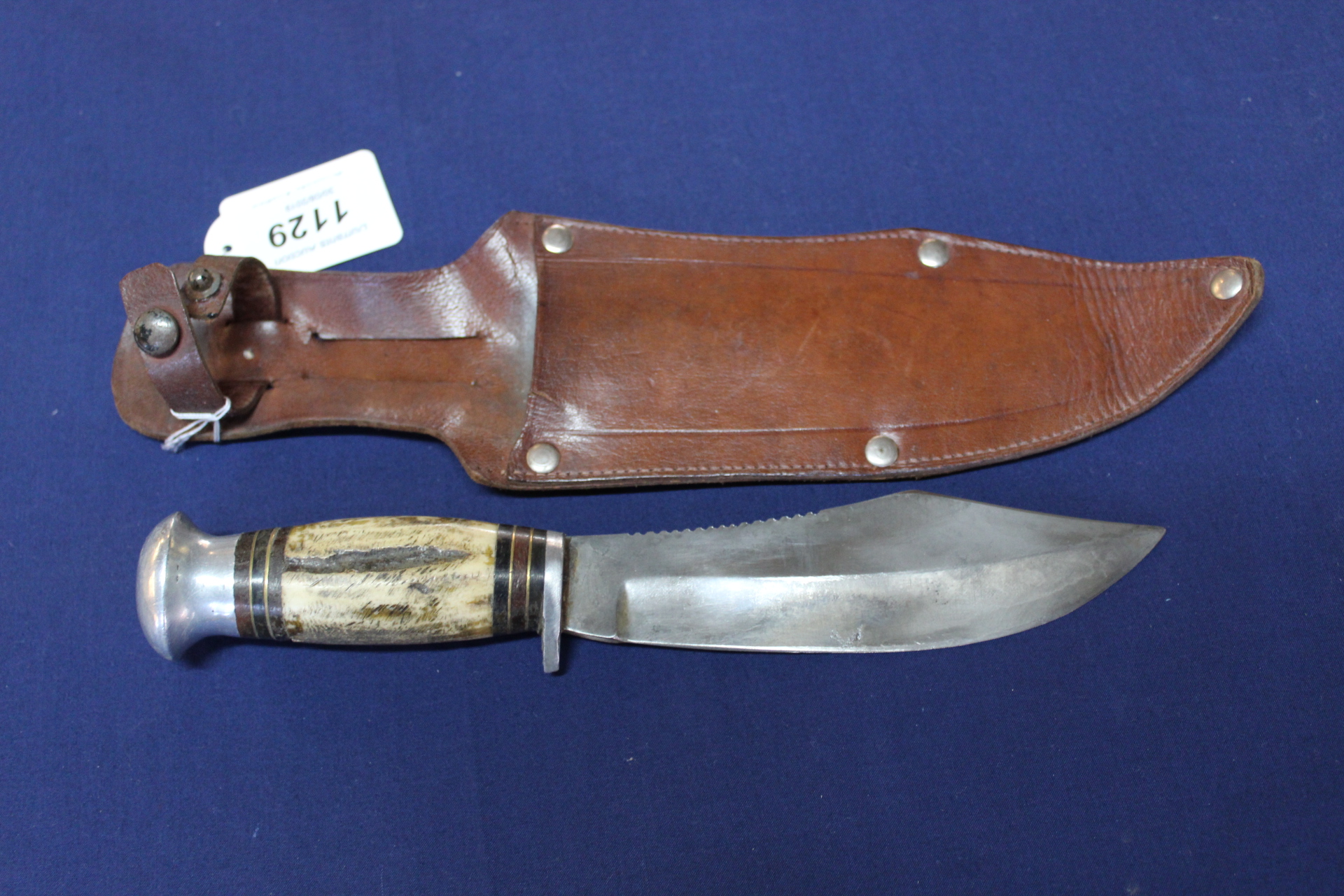 A mid 20th Century sheath knife with leather sheath (very unusual blade)