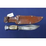 A mid 20th Century sheath knife with leather sheath (very unusual blade)