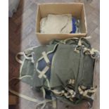 A vintage rucksack with a small quantity of military clothing