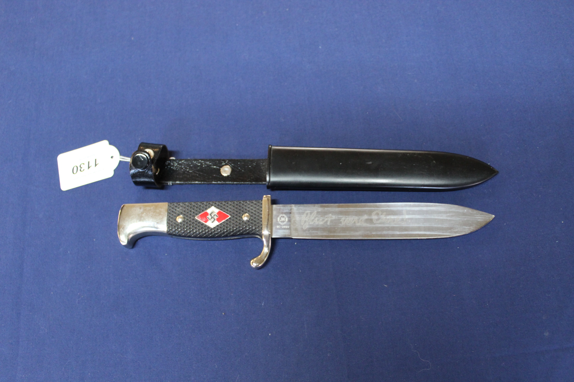 A reproduction Hiltler youth knife with scabbard