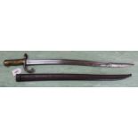 A brass hilted sabre bayonet complete with scabbard