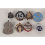 A collection of badges including two A.R.P.