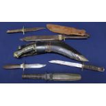 A Kukri with six other various knives including a 'cut-down' 1913 bayonet
