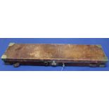 A leather covered gun case with brass furniture,