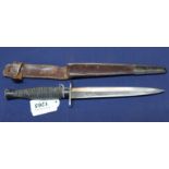 A French post war F&S style commando knife complete with correct sheath