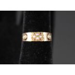 An antique 15ct gold ring set with split pearls and rubies,