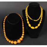 Two amber colour necklaces