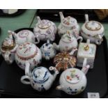 Various porcelain collectors teapots in antique style