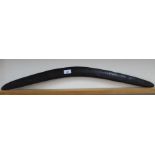 An Australian boomerang with hatched carving,