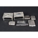 A mixed lot of silver items including two large embossed matchbox holders, three vestas,