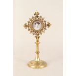 A Victorian gilt metal monstrance with photo insert