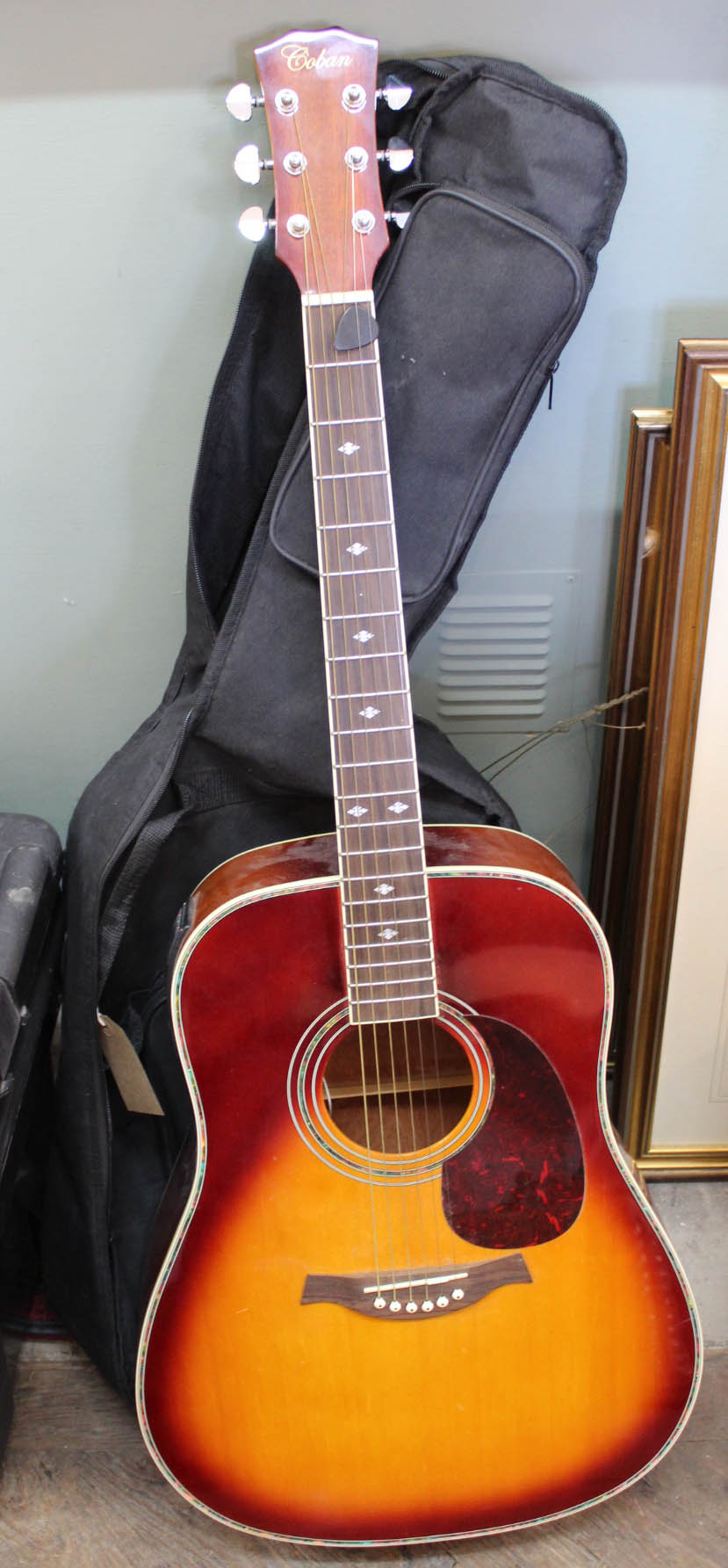An acoustic guitar in case