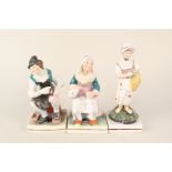 A pair of 19th Century Staffordshire cobbler and wife figures plus one of a girl (restored neck)