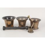 Four 18th and 19th Century bronze pestles and mortars