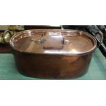 A 19th Century twin handled oval seamed copper fish kettle with lid,
