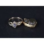 A 9ct gold tanzanite and diamond ring with a small 9ct gold heart shaped locket
